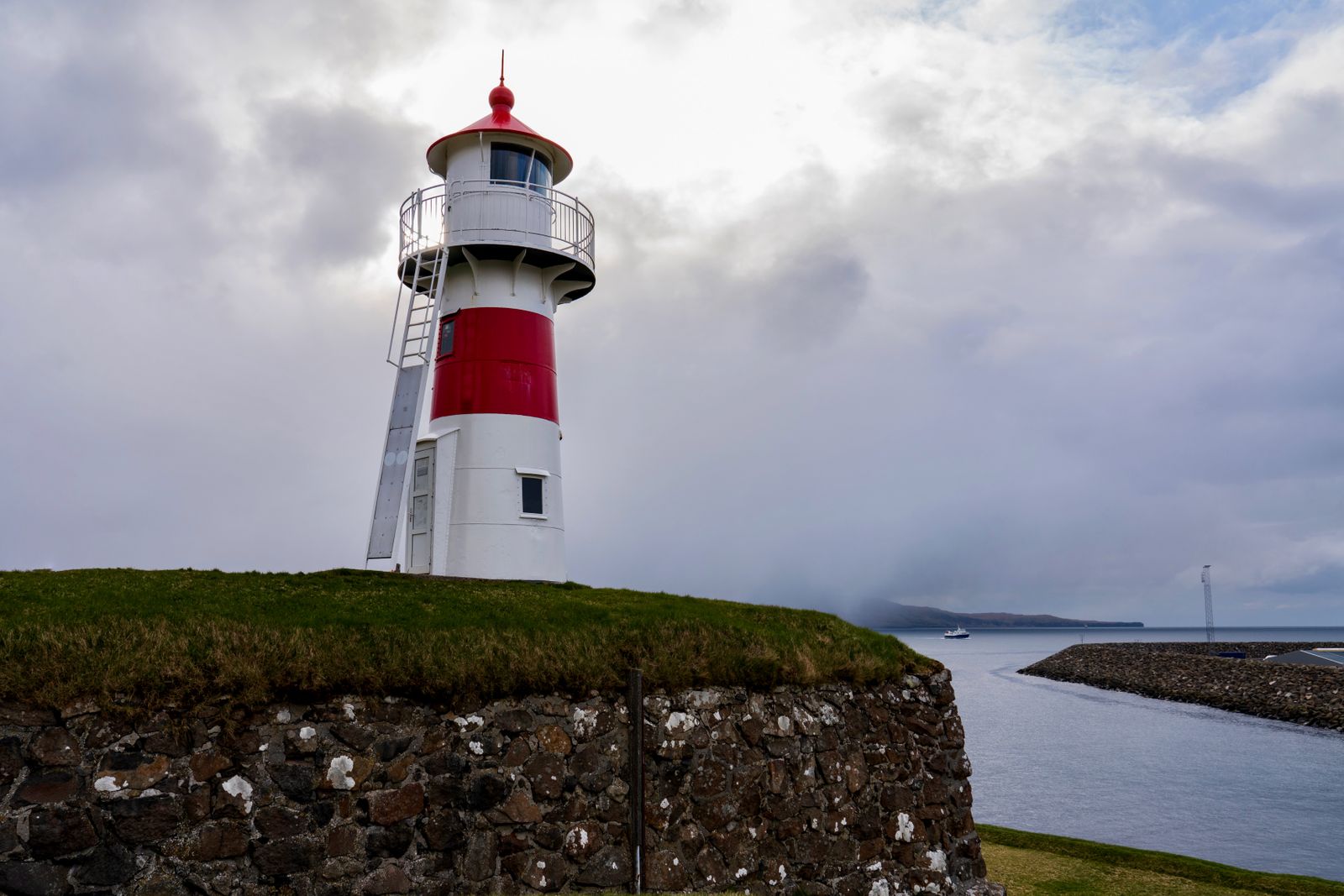The small red-and-white lighthouse on Tórshavn's old fort above the harbour