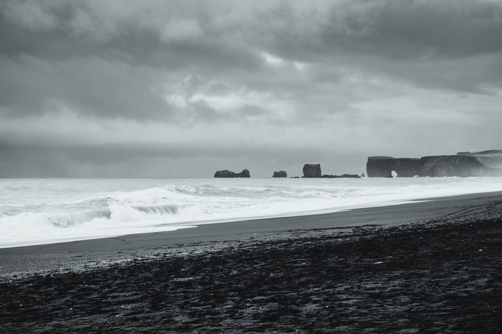 Waves breaking on a black sand beach in Iceland