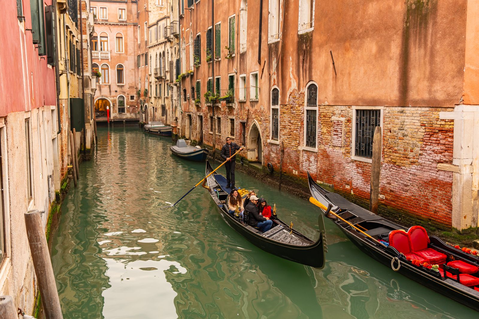 Gondolas resting on a quiet Venetian canal